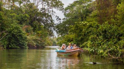 Negombo Sri Lanka July 24 2017 - Tourists take a boat ride through one of the lagoons at Negombo. There is a vast network of lagoons and canals throughout Negombo.